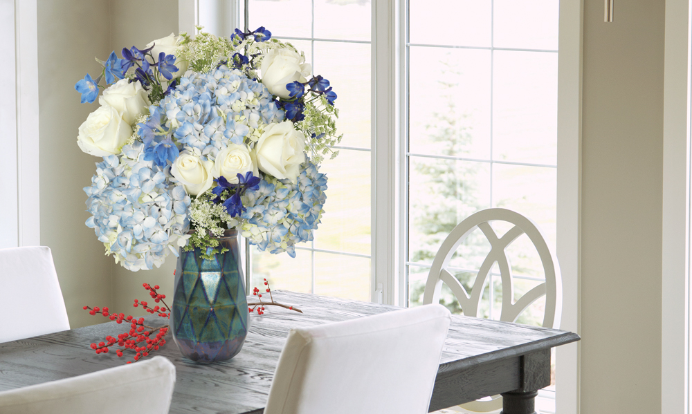 Bouquet with blue hydrangeas and white roses.