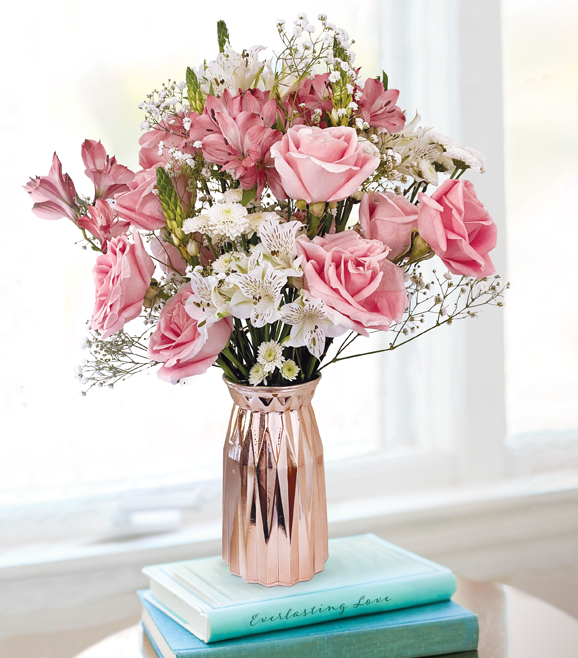 bouquet of pink roses and white lilies in a vase